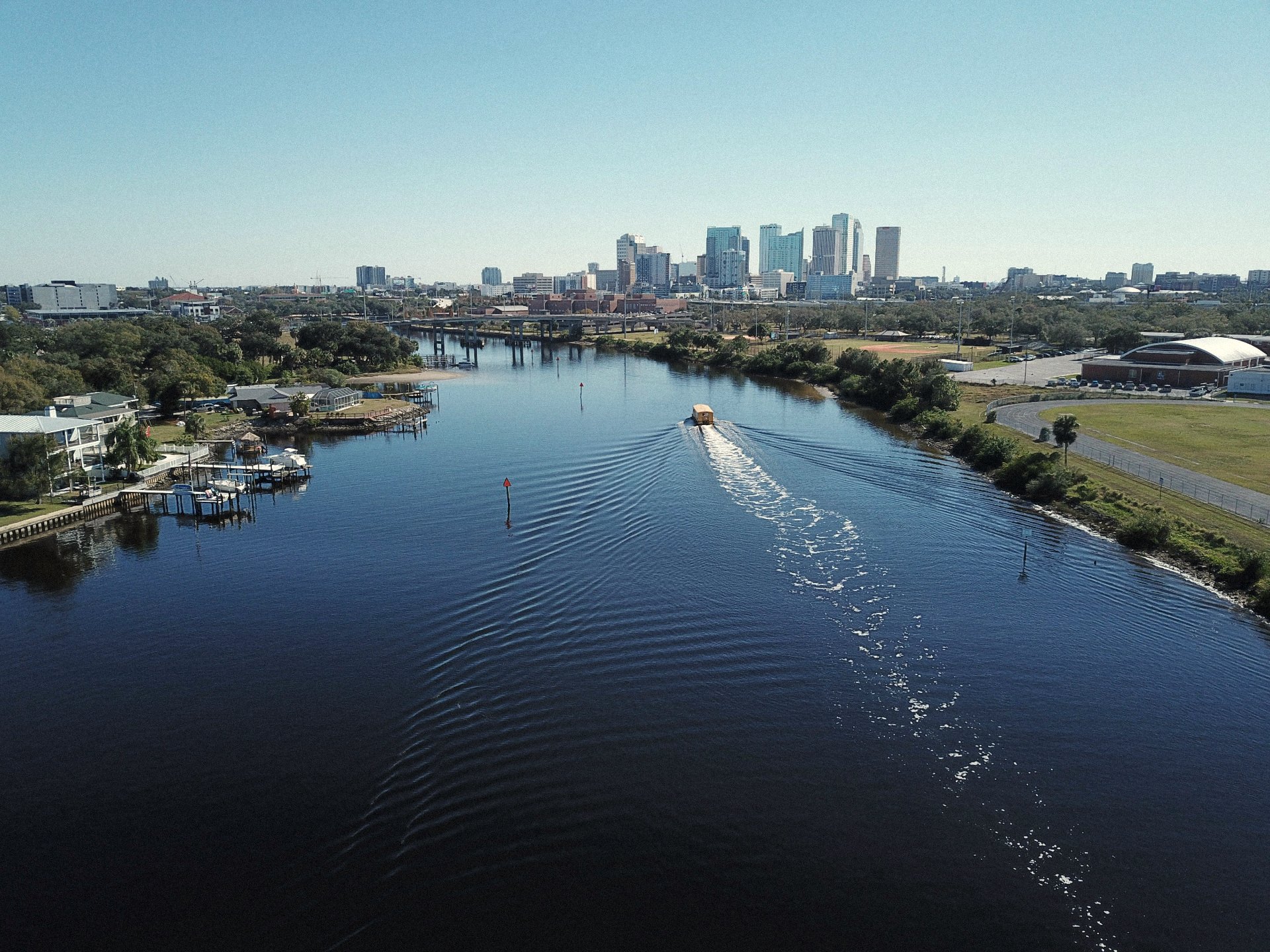 Hillsborough River winding past private docks toward downtown Tampa
